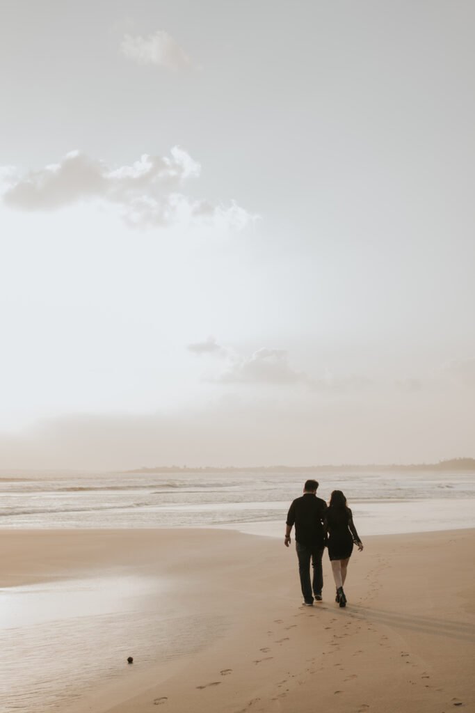 Bride-to-be smiling naturally during her romantic pre-wedding portrait session by the sea in Diu.
