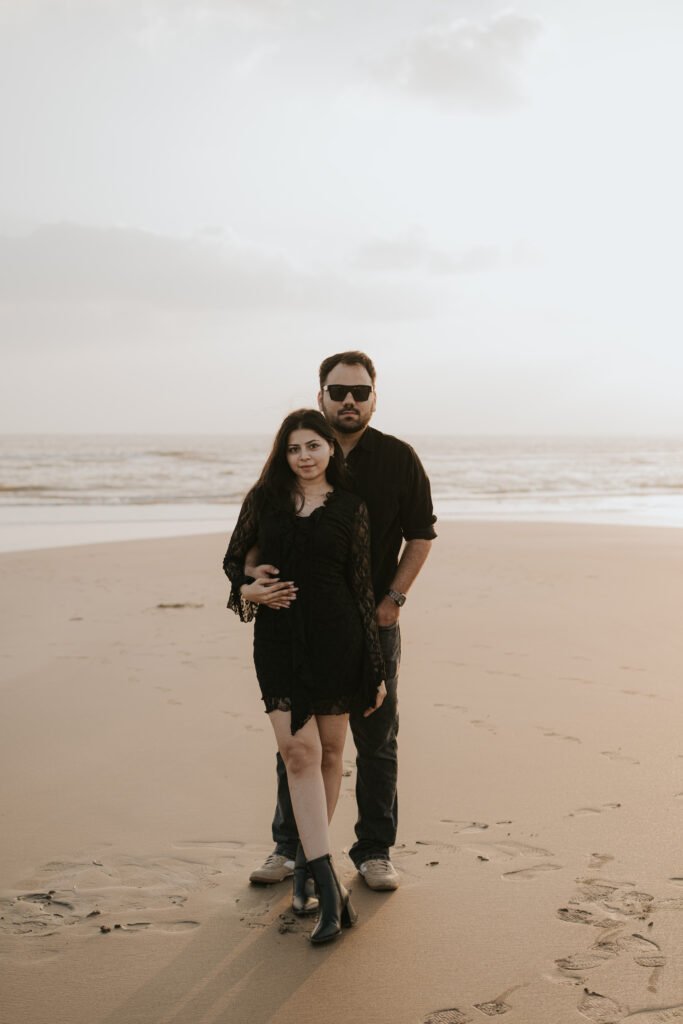 Couple enjoying a natural beach walk during their romantic pre-wedding photography session in Diu.