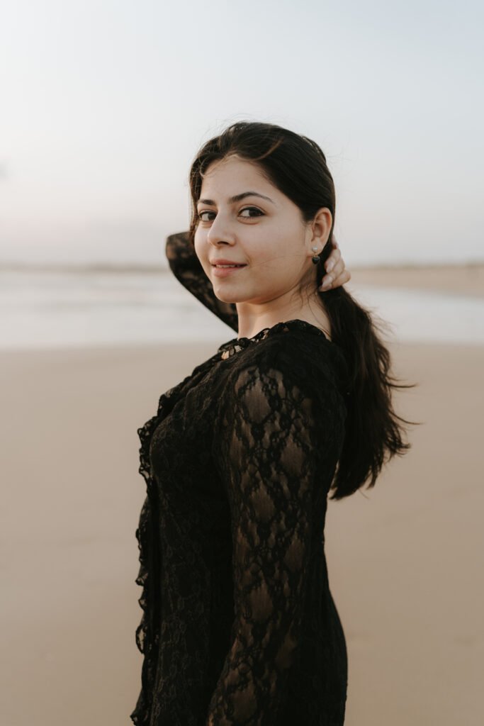 Romantic couple embracing on Diu beach during golden hour pre-wedding photography.