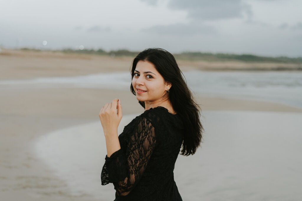 Bride-to-be portrait in a black lace dress during a beach couple photoshoot in Diu.